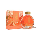 Ink bottle and packaging with scenic design on a white background