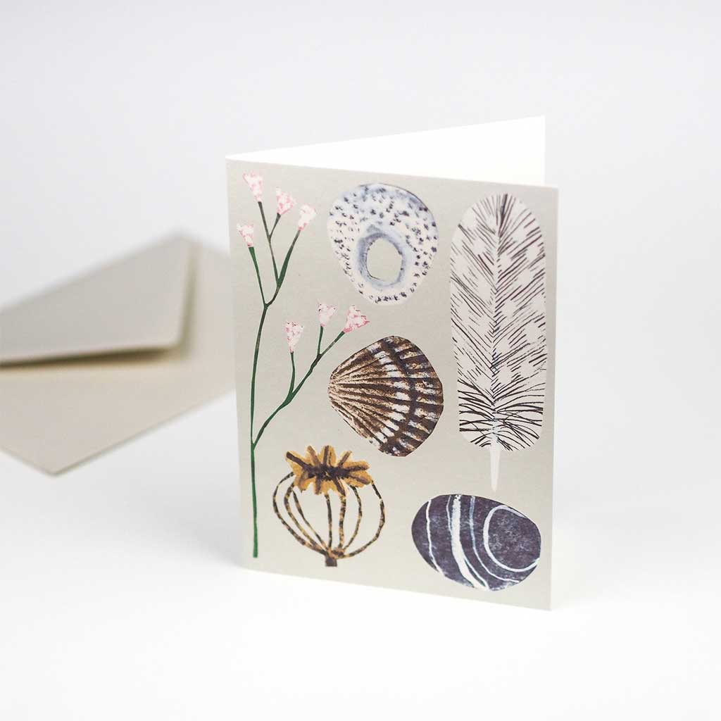 Greeting card with nature-themed illustrations on a white background