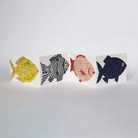 Unfolded fish concertina card on white background