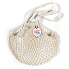 Beige mesh bag with a Filt brand label on a white background