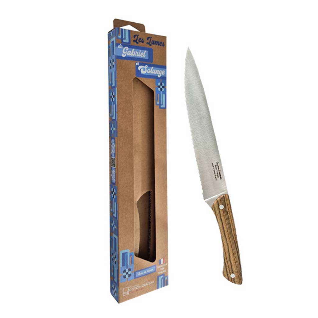 Stainless steel bread knife with two-toned jennywood handle and rivets next to packaging on white background