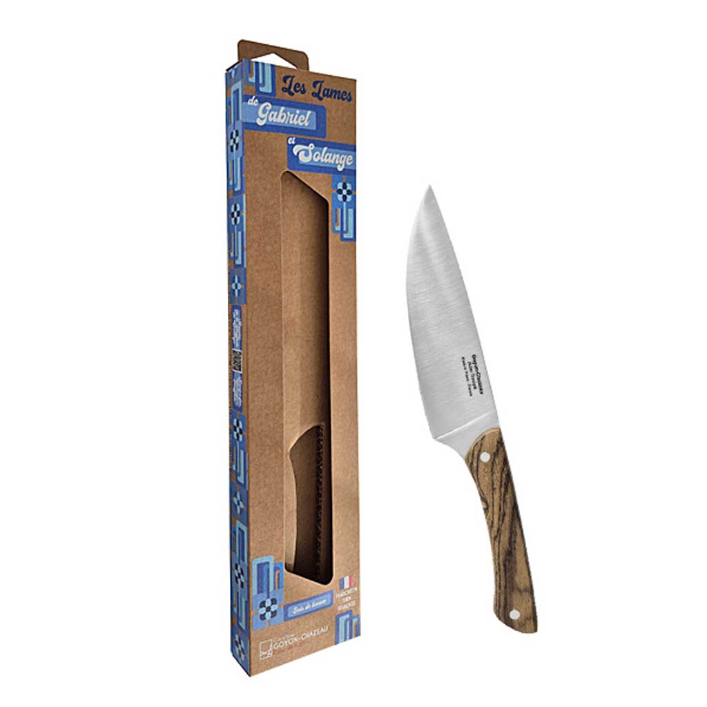 Stainless steel chef's knife with two-toned jennywood handle and rivets next to packaging on white background