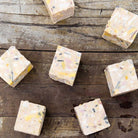 Bars of SallyeAnder stain removing Gardener's Hand Soap on wooden table