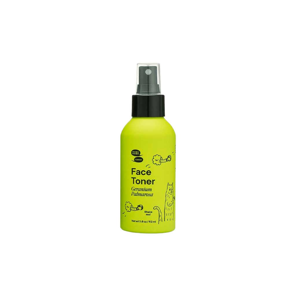 Yellow bottle of face toner with black spray nozzle on a white background