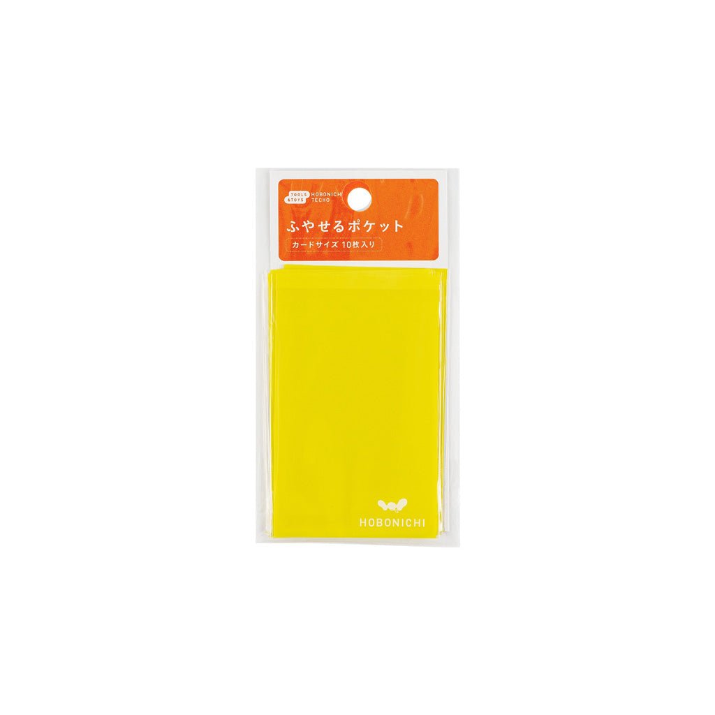 Bright yellow add-on card size pocket for Hobonichi planner on white background