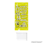 A sheet of clear acrylic stamps featuring various Moomin characters and objects on a bright yellow backing, shown above a clear rectangular stamp block on a white background.