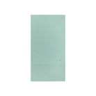 A mint green notebook with grid lines on the top and bottom borders, featuring a small silver monogram logo on the lower right, set against a plain white background.