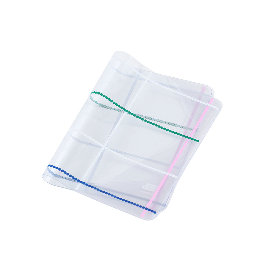 Clear cover for A6 Hobonichi Techo cover with colorful dotted plaid pattern against white background