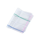 Clear cover for A6 Hobonichi Techo cover with colorful dotted plaid pattern against white background