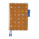 Clear cover on cover with colorful object design on top of brown fabric cover for Hobonichi Techo Cousin A5 planner on white background