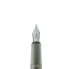Close-up of a fountain pen nib with the text 'Write with Joy' and gray barrel against a plain white background.
