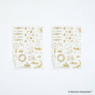 Two sheets of gold foil stickers featuring Moomin Characters designs, displayed on a clean white background.