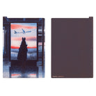Front and back of a rectangular pencil board for A5 Techo. The front design has a rabbit figure in front of airport window with colorful sunset, and the back is a plain dark purple. 