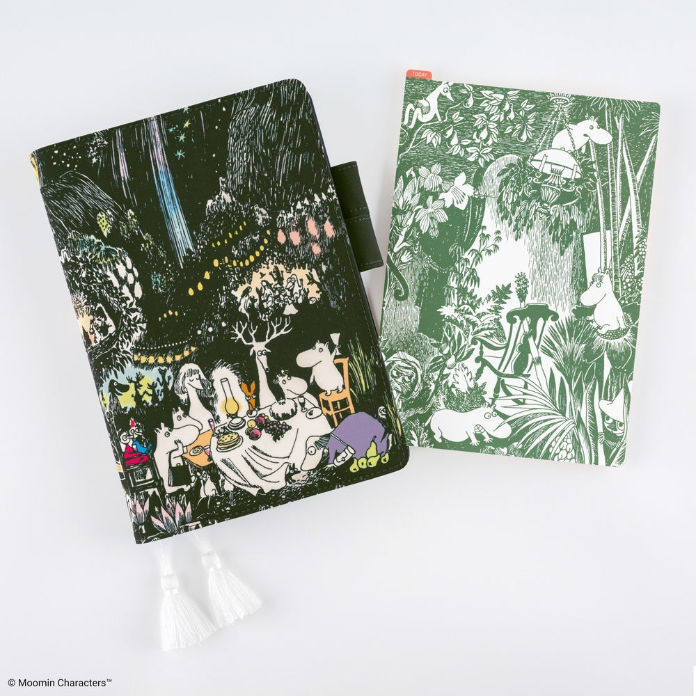 A5 notebook with Moomin dinner party scene design next to an A5 pencil board with green Moomin illustration against a white background