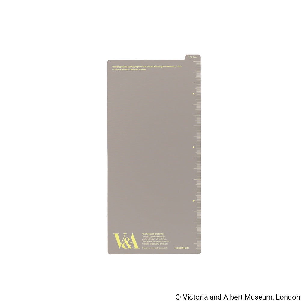 Back of pencil board for Techo Weeks with plain gray background and pale yellow V&A logo in corner against white background