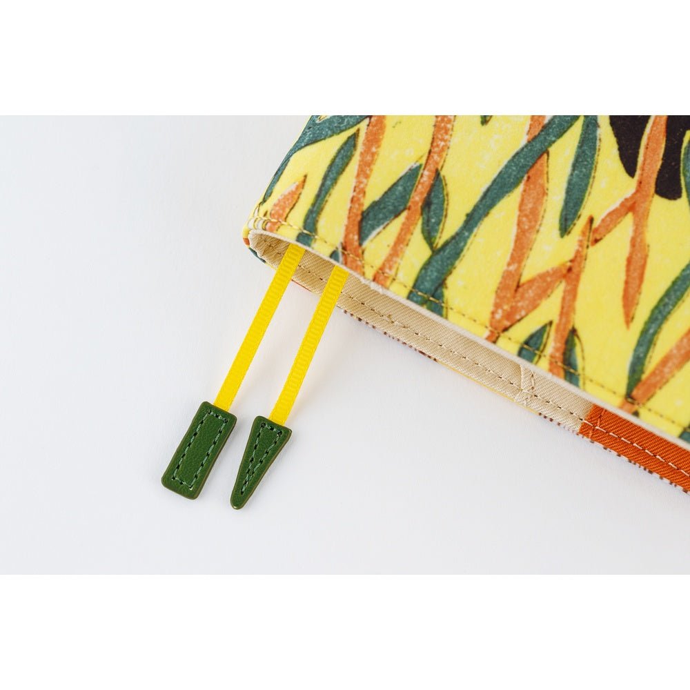 Close up of yellow page keeper bookmarks of Hobonichi Unsodo A5 Cousin Book with Cover