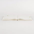 Open Hobonichi Techo 2026 Cousin A5 Spring Start planner laying flat on white surface