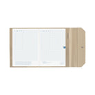 An open beige Hobonichi Alettone cover holding a gridded Hobonichi planner, with interior pockets, pen hook, and snap closure visible on a plain white background.