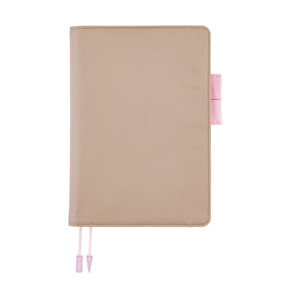 Greige colored Hobonichi Techo cover with contrast pink stitching, pink pen loops, and two pale pink ribbon bookmarks with tabs shown on a plain white background.