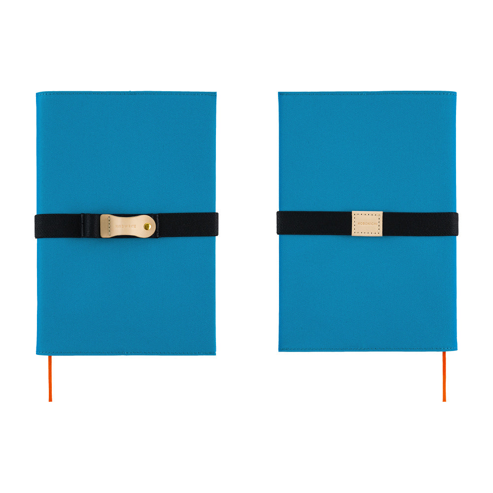 The front and back of a blue Hobonichi Techo cover shown side by side on a white background, each wrapped with a black elastic band and a natural leather pen loop.