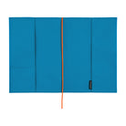 The interior of a bright blue Hobonichi Techo cover with pockets and a bright red ribbon bookmark, shown flat against a white background.