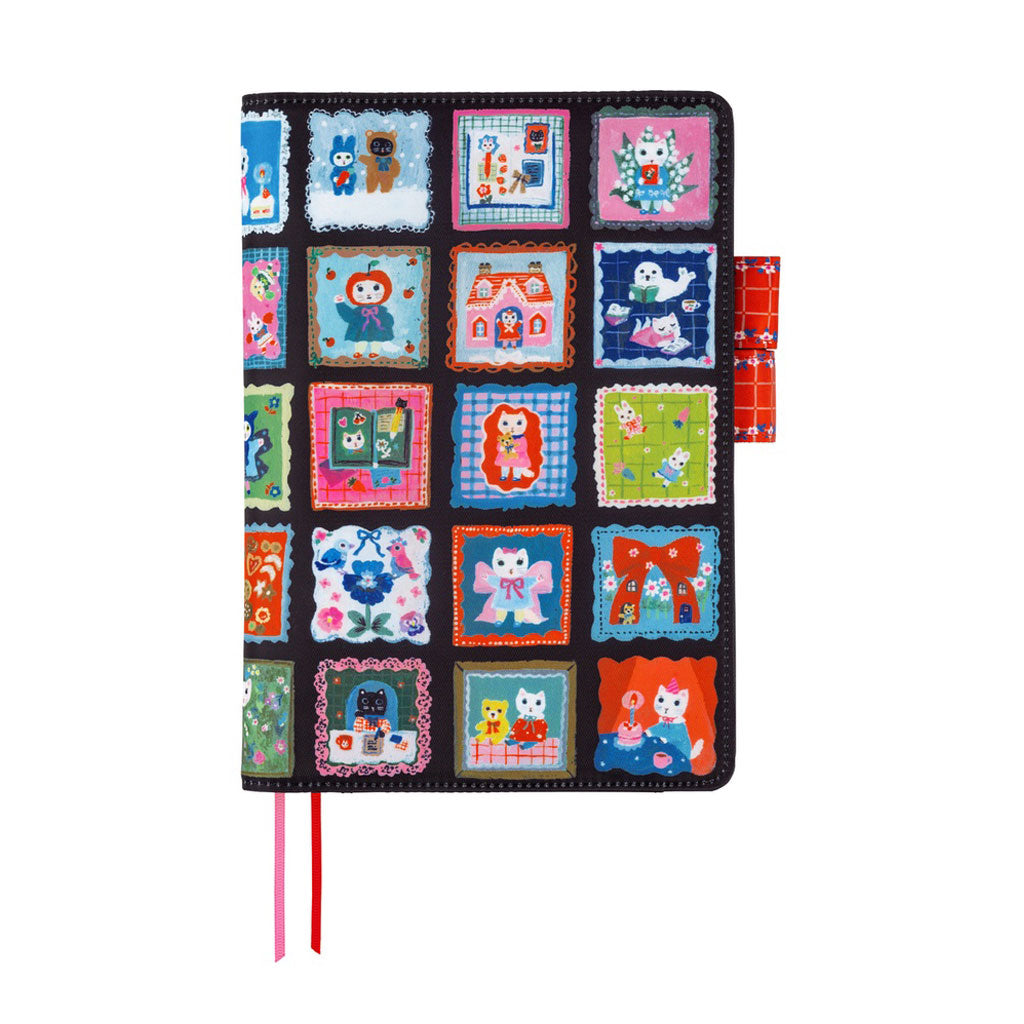 A black Hobonichi Techo cover decorated with a colorful grid of patchwork-style square panels, each featuring different whimsical cat illustrations. It has two ribbon bookmarks, one pink and one red, and two red pen closure loops against a plain white background.