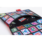 The exterior pocket of a Hobonichi Techo cover decorated with a colorful grid of patchwork-style square panels. Inside the pocket are additional decorative illustrations of whimsical cats and flowers. 