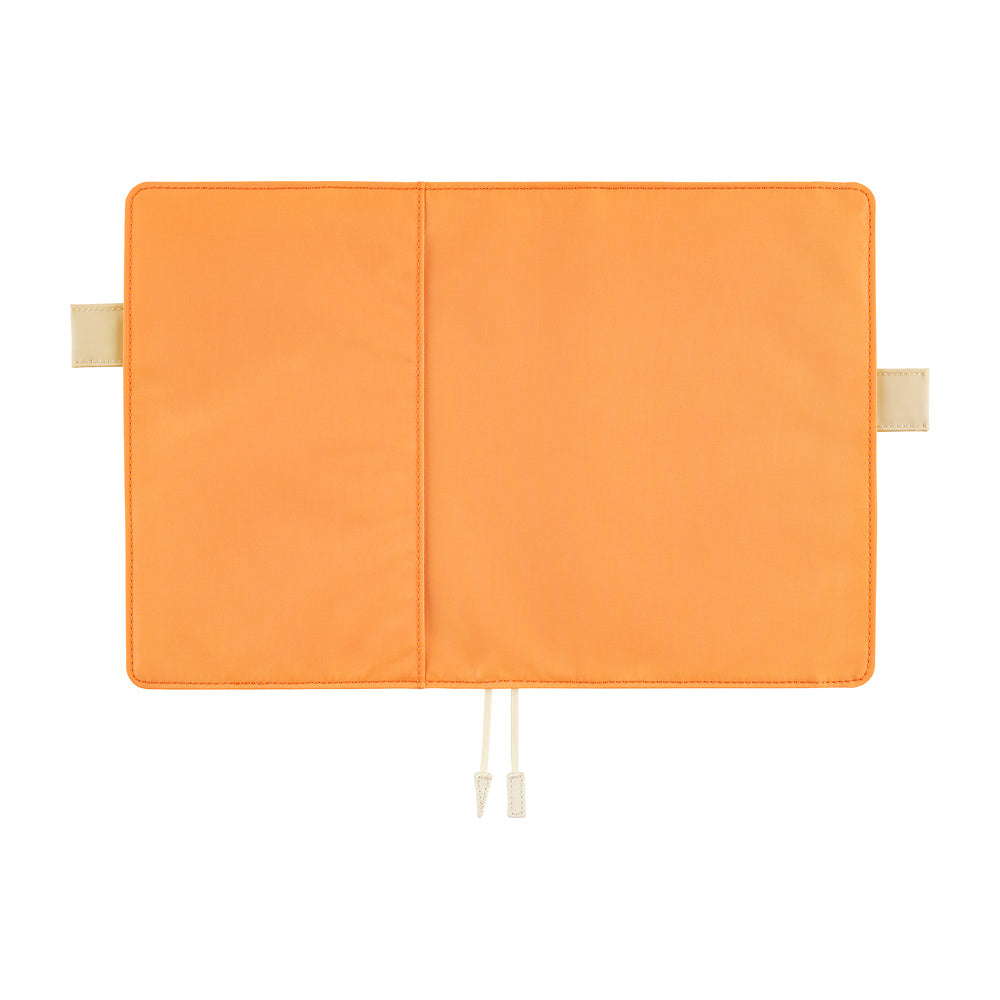 An orange cover shown flat against a white background, featuring a central seam, two ivory hook-and-loop tabs on the sides, and a ivory ribbon bookmarks.