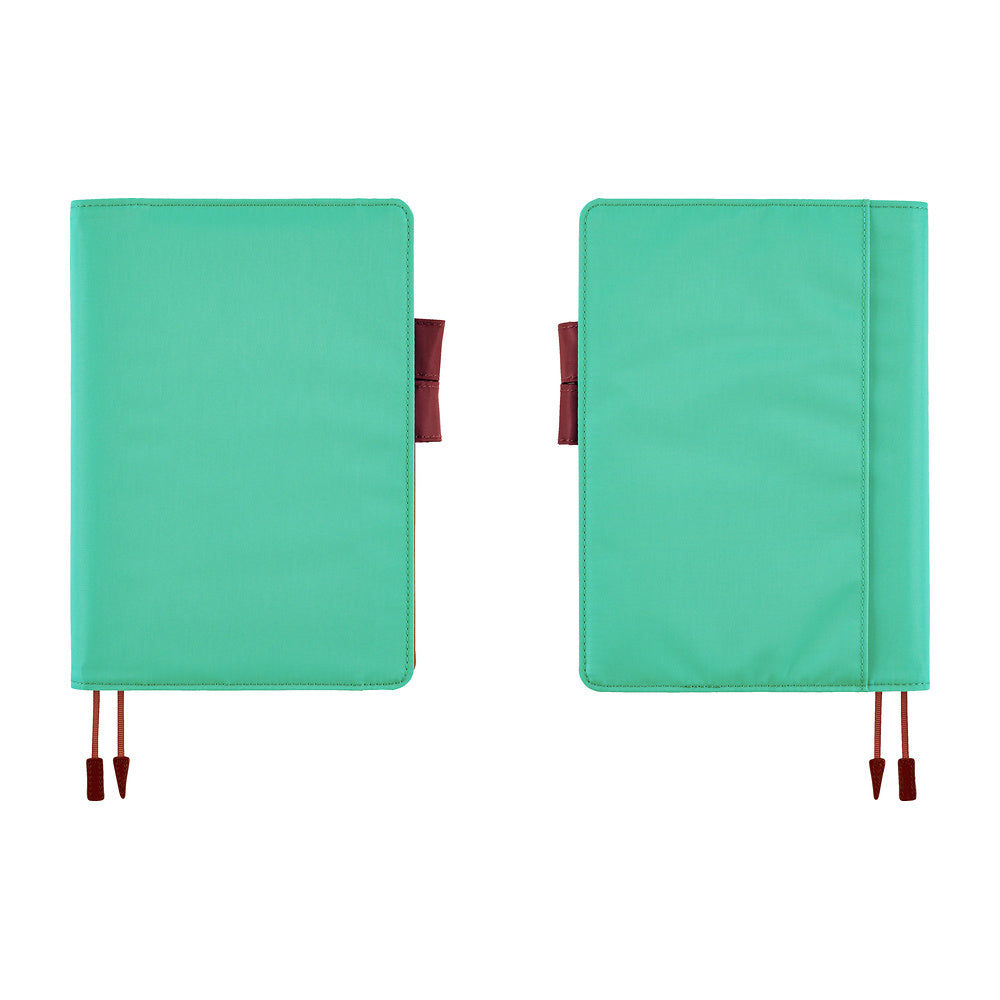 Two turquoise planner covers shown side by side on a white background, each with a brown red ribbon bookmarks and tabs.