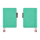 Two turquoise planner covers shown side by side on a white background, each with a brown red ribbon bookmarks and tabs.
