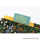 Close-up of a fabric pen loop with a printed William Morris quote that says, "Have nothing in your houses that you do not know to be useful or believe to be beautiful."