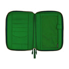 An open green-colored Hobonichi Techo zippered cover showing multiple interior card and storage pockets, a large mesh pocket, and a built-in pen holder on a plain white background.