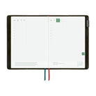 An open weekly planner featuring white grid pages, and colored ribbon bookmarks in red and blue, shown on a plain white background.
