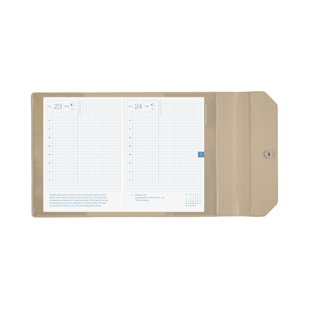 A beige plastic pocket organizer cover shown open, displaying two white grid daily planner inserts with blue text and numbers on a plain white background.