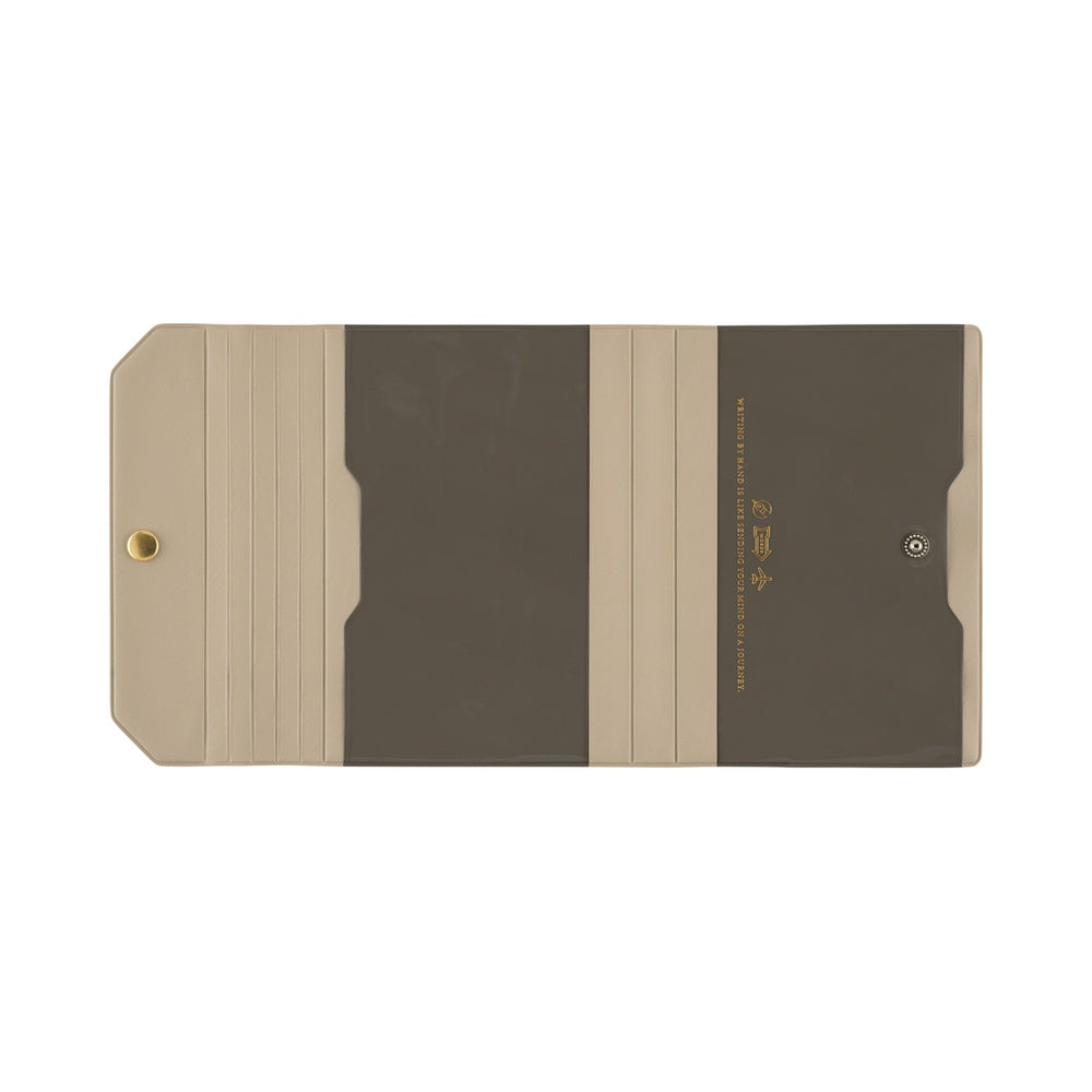 A minimalist folder or document holder with a modern geometric design in beige and dark brown, featuring a gold rivet on the left and gold text on the right, shown against a plain white background.