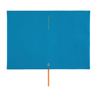 A bright blue rectangular book cover or notebook sleeve with a small gold logo near the bottom and a thin orange ribbon bookmark hanging from the center, shown on a plain white background.