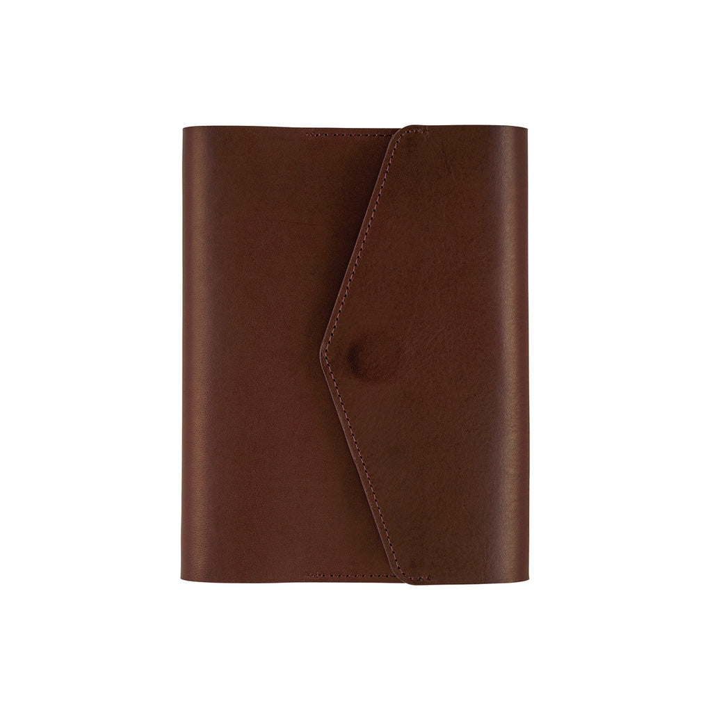 A brown leather notebook cover or planner sleeve with a diagonal flap closure and snap button, shown on a plain white background.