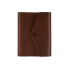 A brown leather notebook cover or planner sleeve with a diagonal flap closure and snap button, shown on a plain white background.