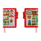 Two views of a small fabric journal or notebook cover with a colorful whimsical house illustration on a red border, shown on a plain white background.