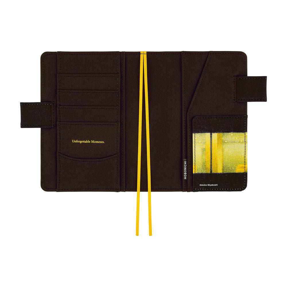 A dark brown leather organizer pouch shown open against a white background, featuring multiple card slots, a clear ID window with yellow accents, and a yellow elastic band.