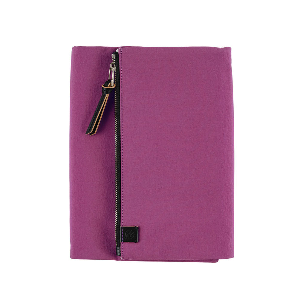 A purple Hobonichi Tragen tri-fold cover with a vertical zippered pouch and black zipper pull on a plain white background.