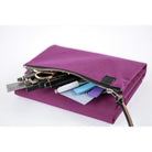 A purple fabric pouch with a zipper closure, shown open with stationery items like pens, a pencil, and sticky notes protruding from the front. The pouch is photographed on a clean white background.