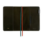 A black leather folio-style tablet sleeve or document holder shown open against a white background, with a vertical two-colored ribbon bookmark or strap in teal and orange running down the center. Small gold branding text is visible near the bottom corners.