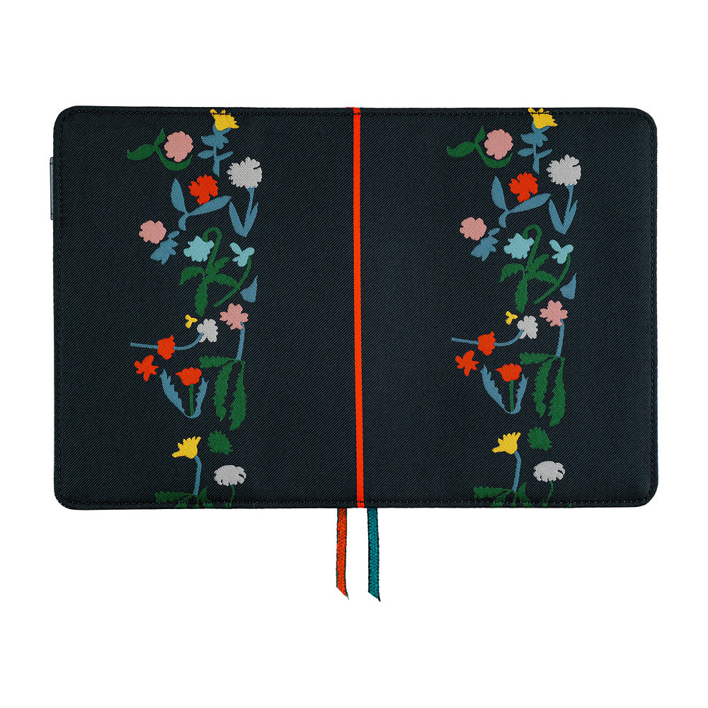 A black notebook or journal cover with embroidered floral designs on both sides and a thin orange center stripe, shown flat against a white background.