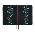 A black notebook or journal cover with embroidered floral designs on both sides and a thin orange center stripe, shown flat against a white background.