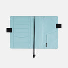 Interior of Hobonichi A5 cover with pen loops and bookmark on white background