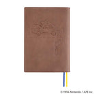 Back of brown leather cover with embossed MOTHER design of pixelated car for Hobonichi Techo Cousin A5 planner on white background