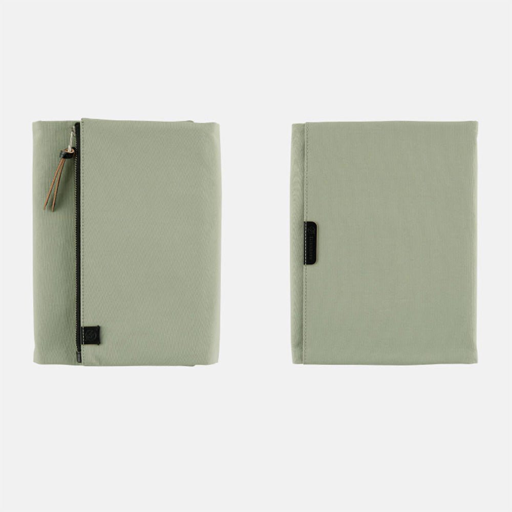 Oakmoss green fabric Tragen zippered cover for Hobonichi Techo Cousin A5 planner on white background