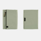 Oakmoss green fabric Tragen zippered cover for Hobonichi Techo Cousin A5 planner on white background
