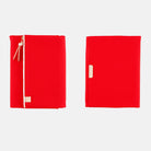 Red fabric Tragen zippered cover for Hobonichi Techo Cousin A5 planner on white background